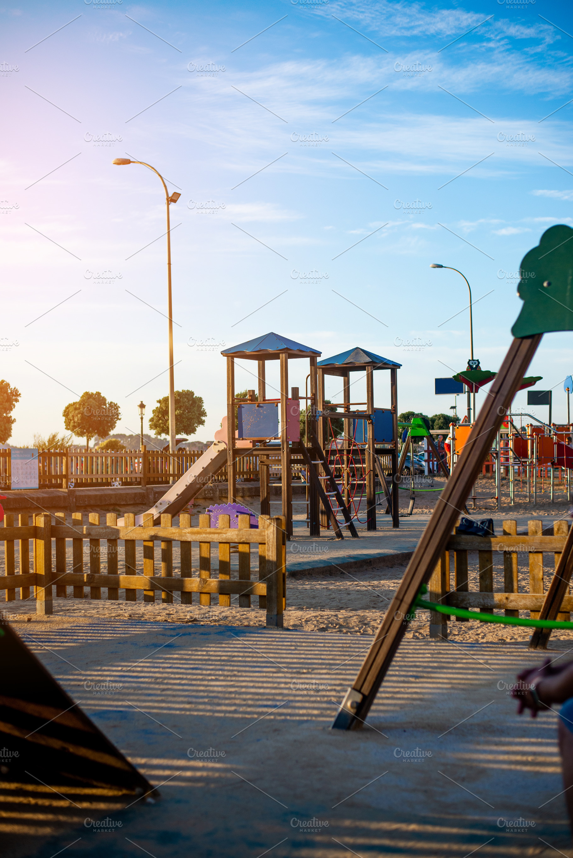 Public kids playground in Spain made of wood and plastic, a Nature Photo by rubenchase
