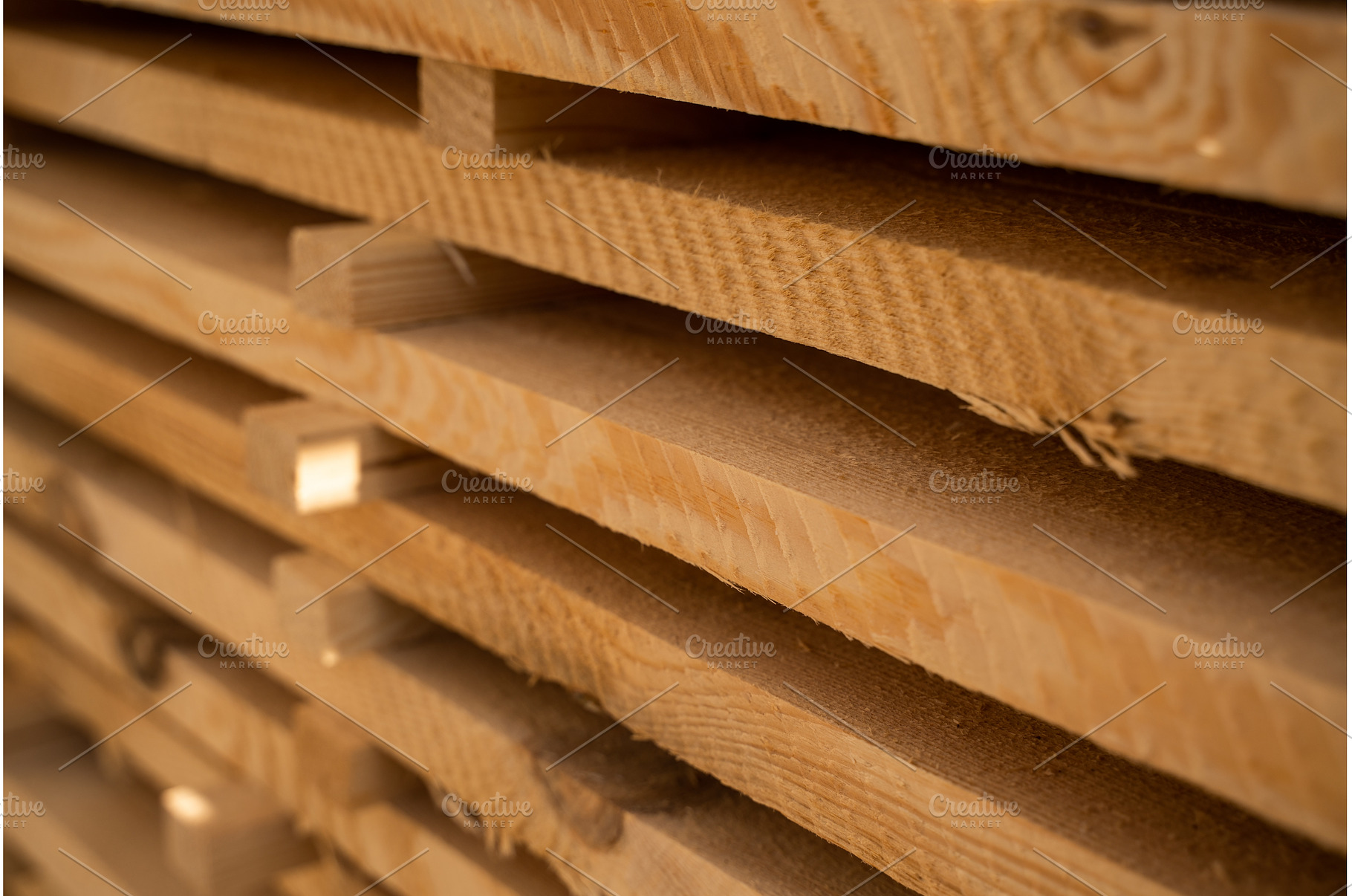Closeup of stacked pine wood planks, an Industrial Photo by volodymyrshtun13795