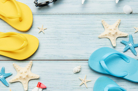 Summer vacation accessories forming a frame on wooden background, a Holiday Photo by Olena Rudo