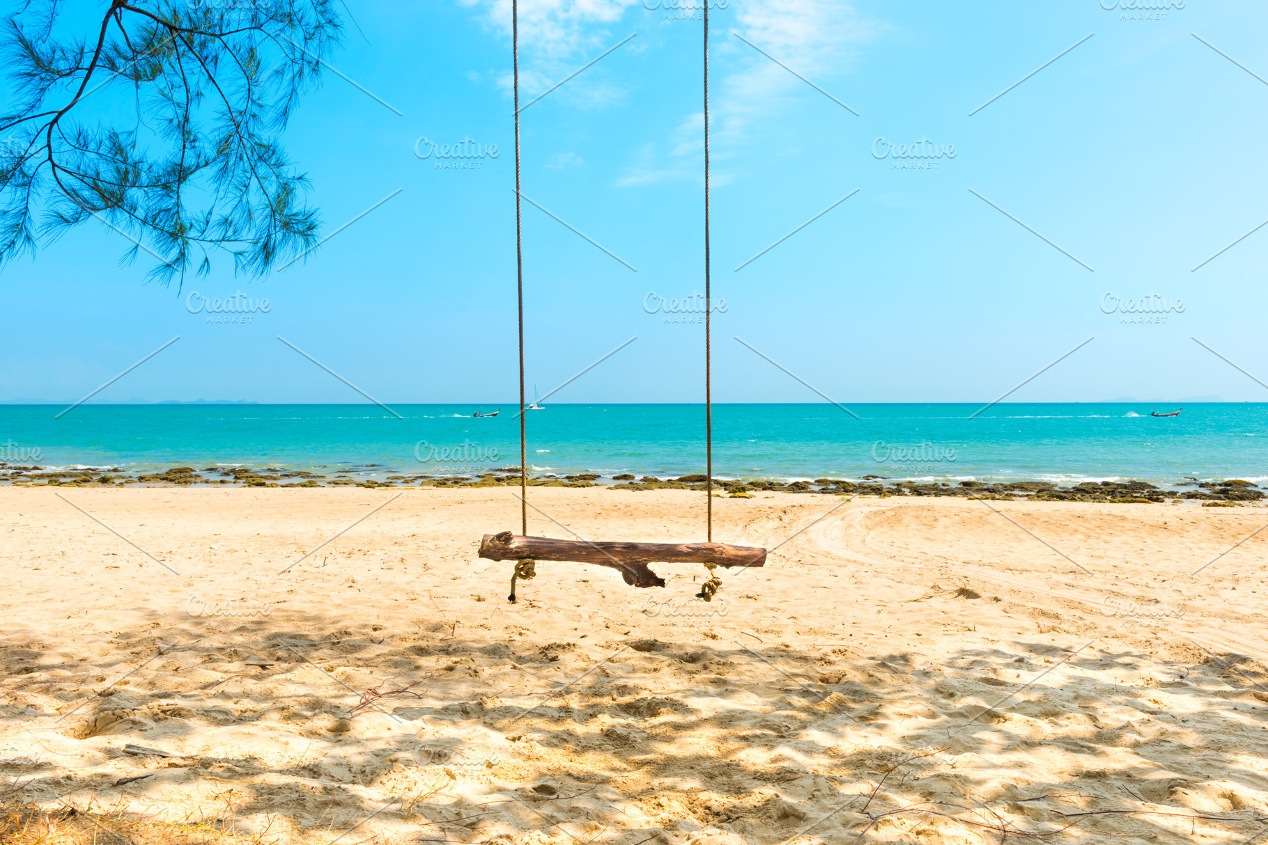 Swing on sand beach at tropical island, a Nature Photo by Vapi