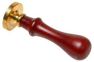 Wax seal with wooden handle and brass stamp on isolated backgrou, an Abstract Photo by ndanko