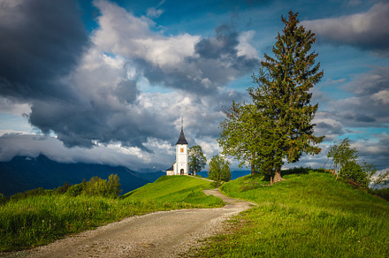 Saint Primoz church on the hill, an Architecture Photo by Alpine Dreams
