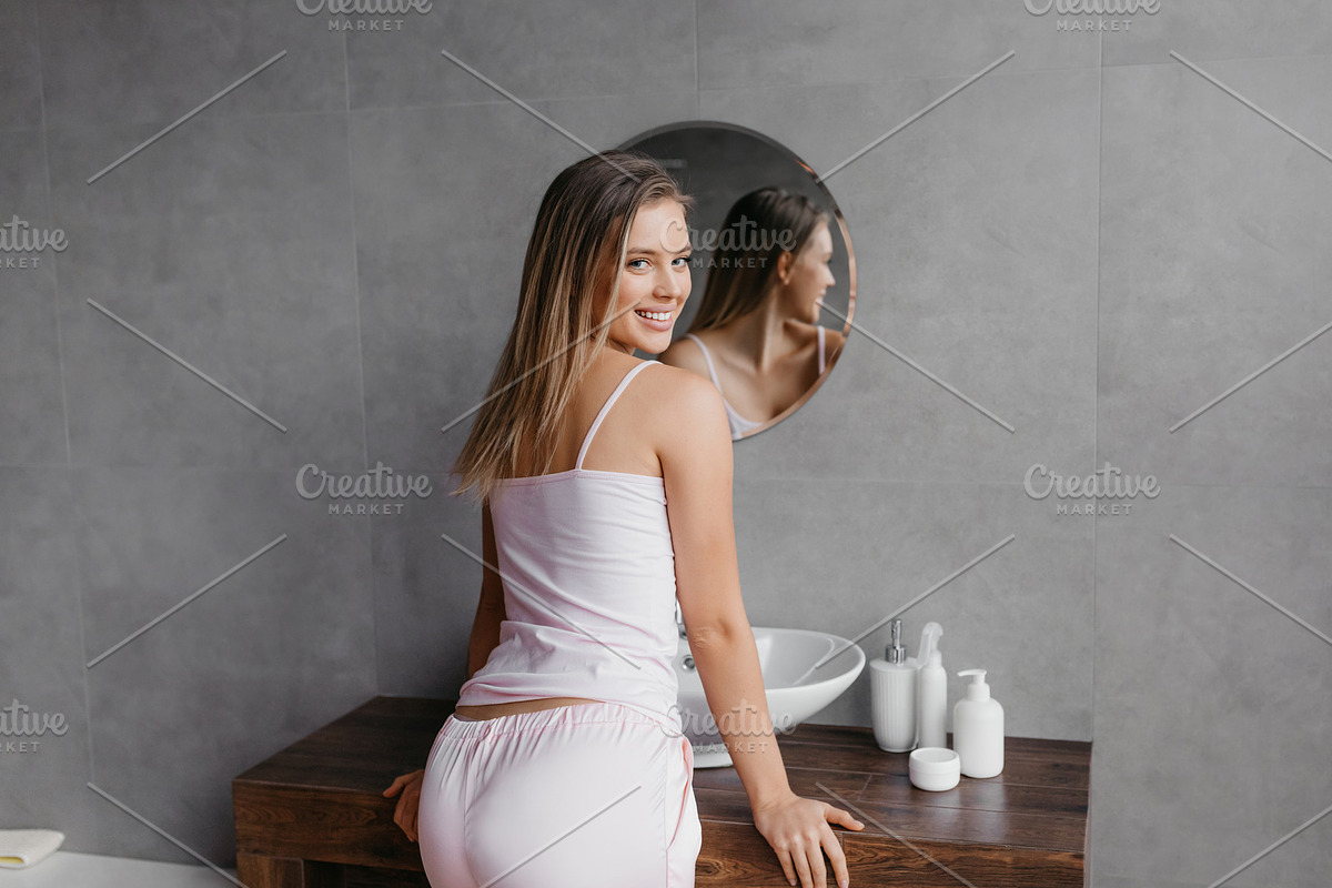 Routine procedures and decorative cosmetics for homemade visage. Happy young wo, a Photo by Prostock-Studio (Photo 2 of 2)
