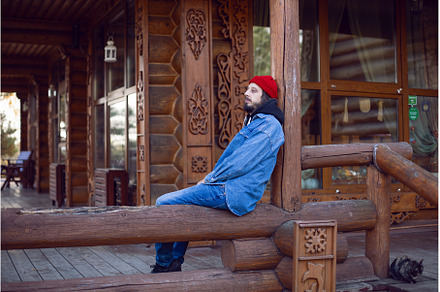 man with a hipster beard in a red, an Architecture Photo by SaulichPhoto
