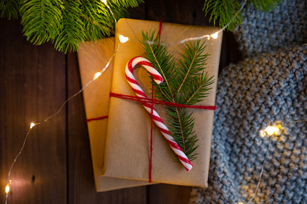 Closeup cozy winter christmas containing gift, wrapping, and wooden