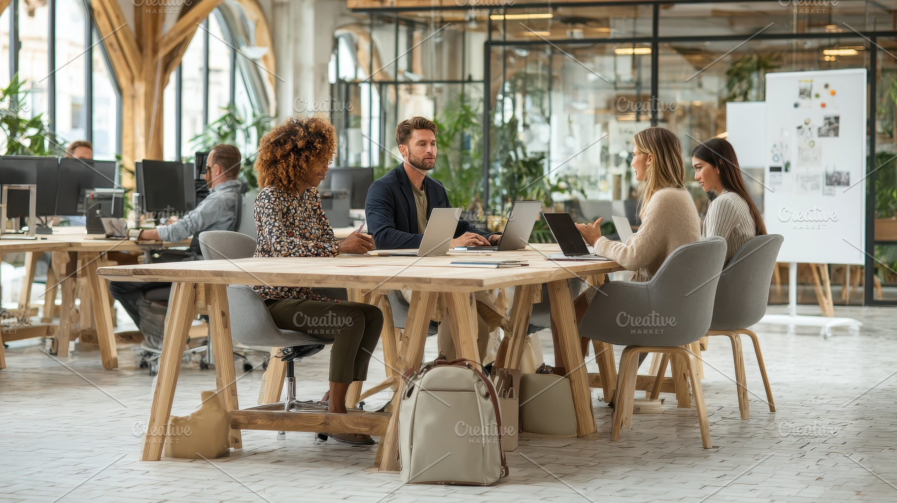 Modern office team collaboration lap, a Photo by Pixeness Studio