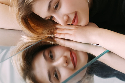 Smiling face mirror reflection happy calm woman, a Person Photo by Photo Drive Studio