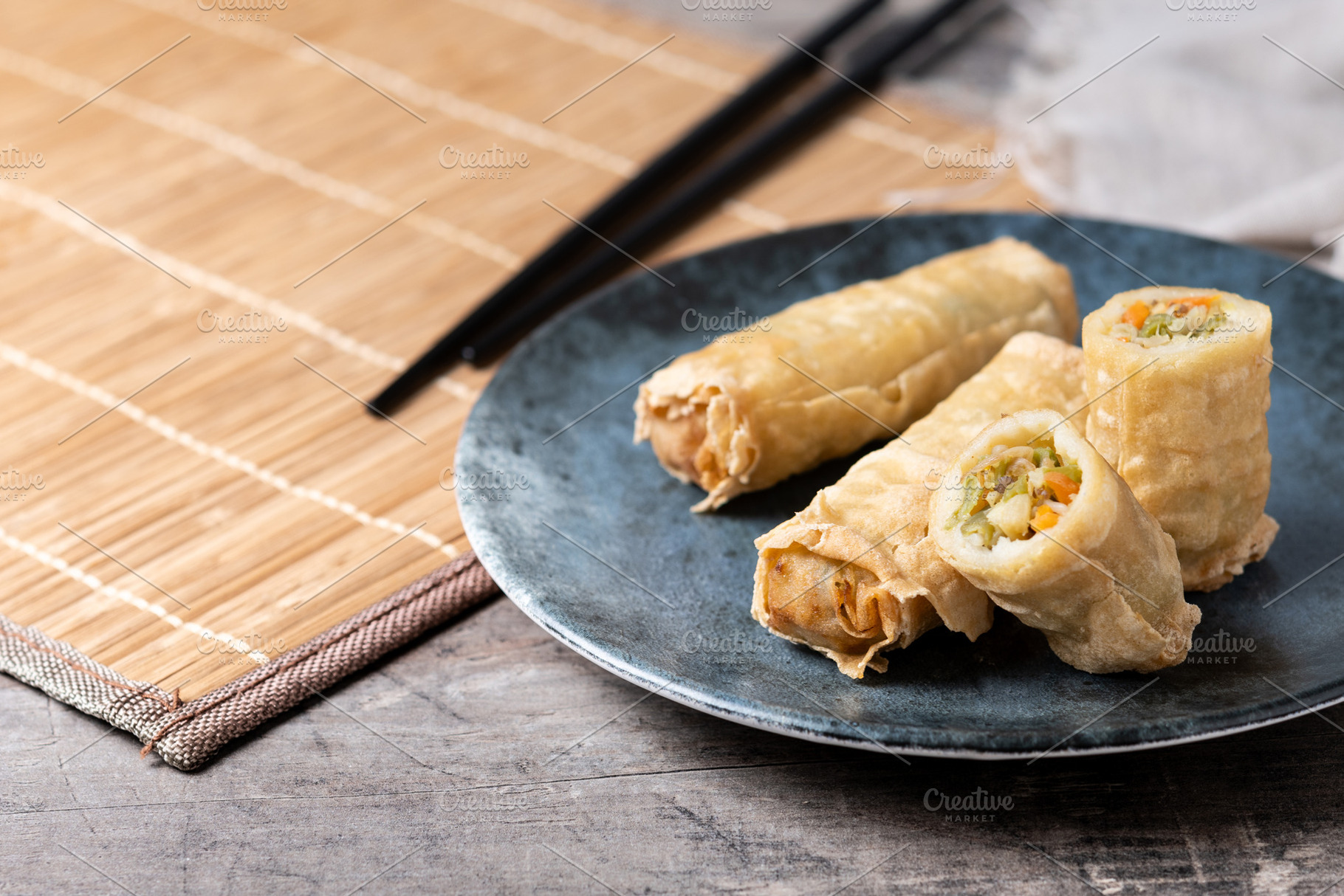 Crispy Spring Rolls on Ceramic Plate on wooden table, a Food & Drink Photo by etorres69