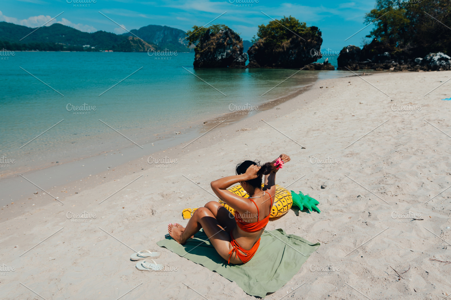 Summer vacation Woman sitting and sunbathing at the beach, a Nature ...