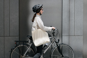 Woman holding eco bag or cotton tote