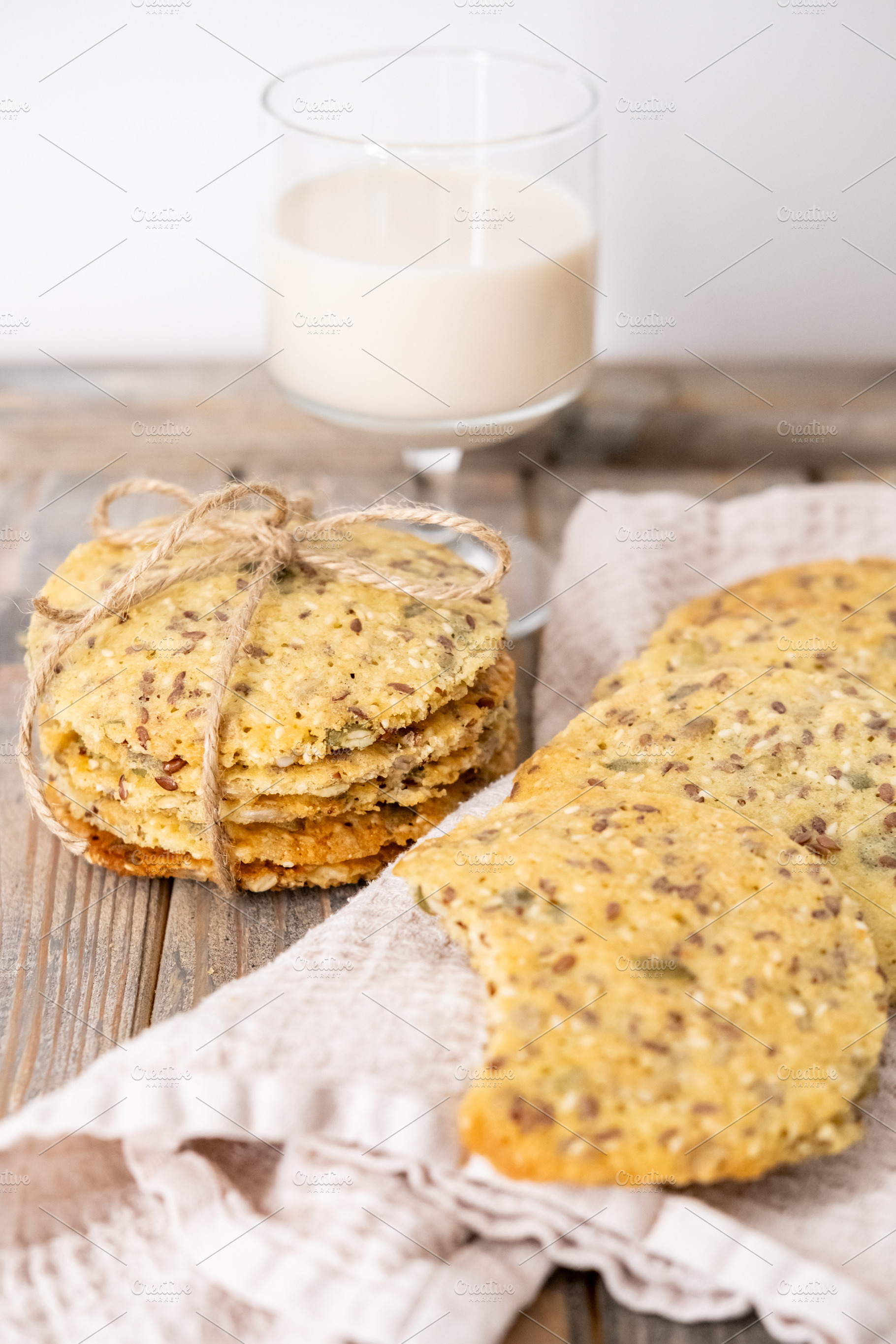 Rustic treat tasty cookies biscuits seeds milk, a Food & Drink Photo by Photo Drive Studio