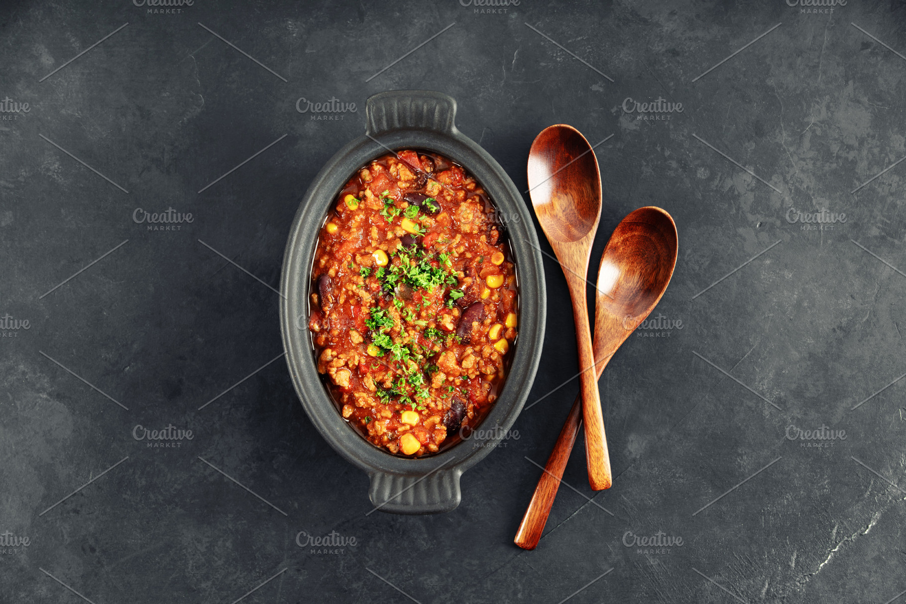 Mexican Chili Con Carne with Wooden Spoons on Dark Background, a Food & Drink Photo by Natalia Klenova's Shop