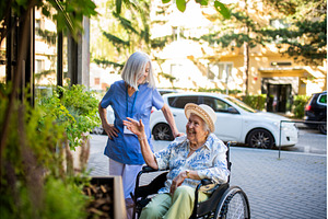 Female nurse assisting old woman in, a Health & Medical Photo by HalfPoint