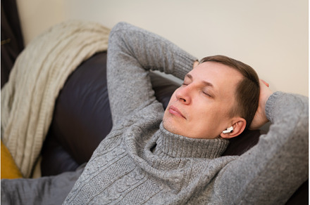 man relaxing on cozy couch, a Holiday Photo by piter.goskov