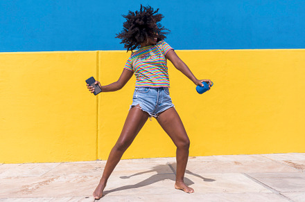 Mixed race smiling black woman portr containing funky, curly, and people