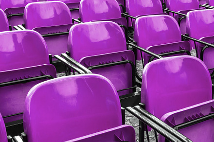 Empty plastic violet chairs, an Abstract Photo by KYNA STUDIO