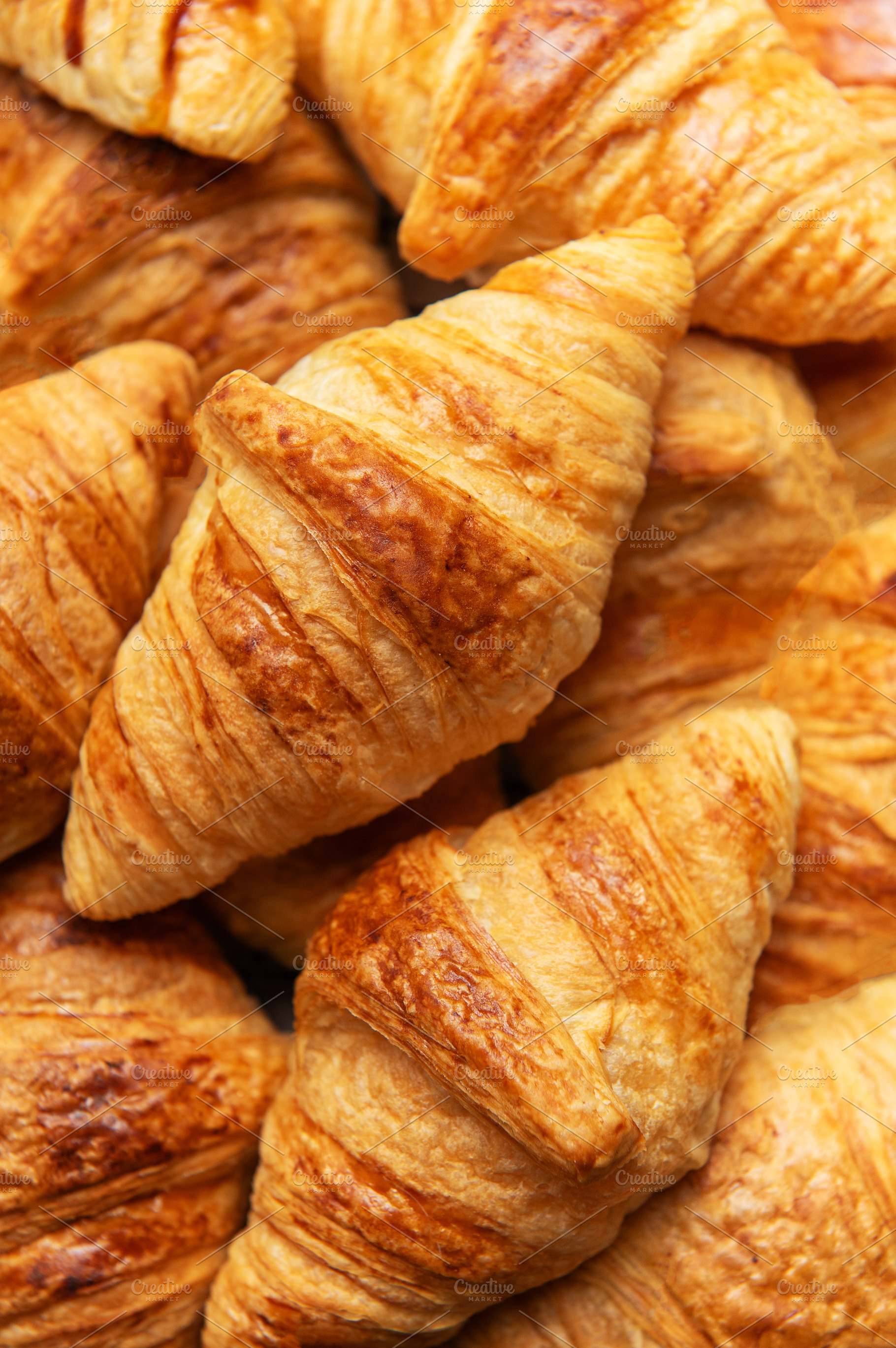 Freshly baked croissants forming an appetising background for fr, a Food & Drink Photo by Olena Rudo