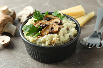 Concept of tasty food with risotto with mushrooms, close up, a Background Photo by AtlasStudio PRO
