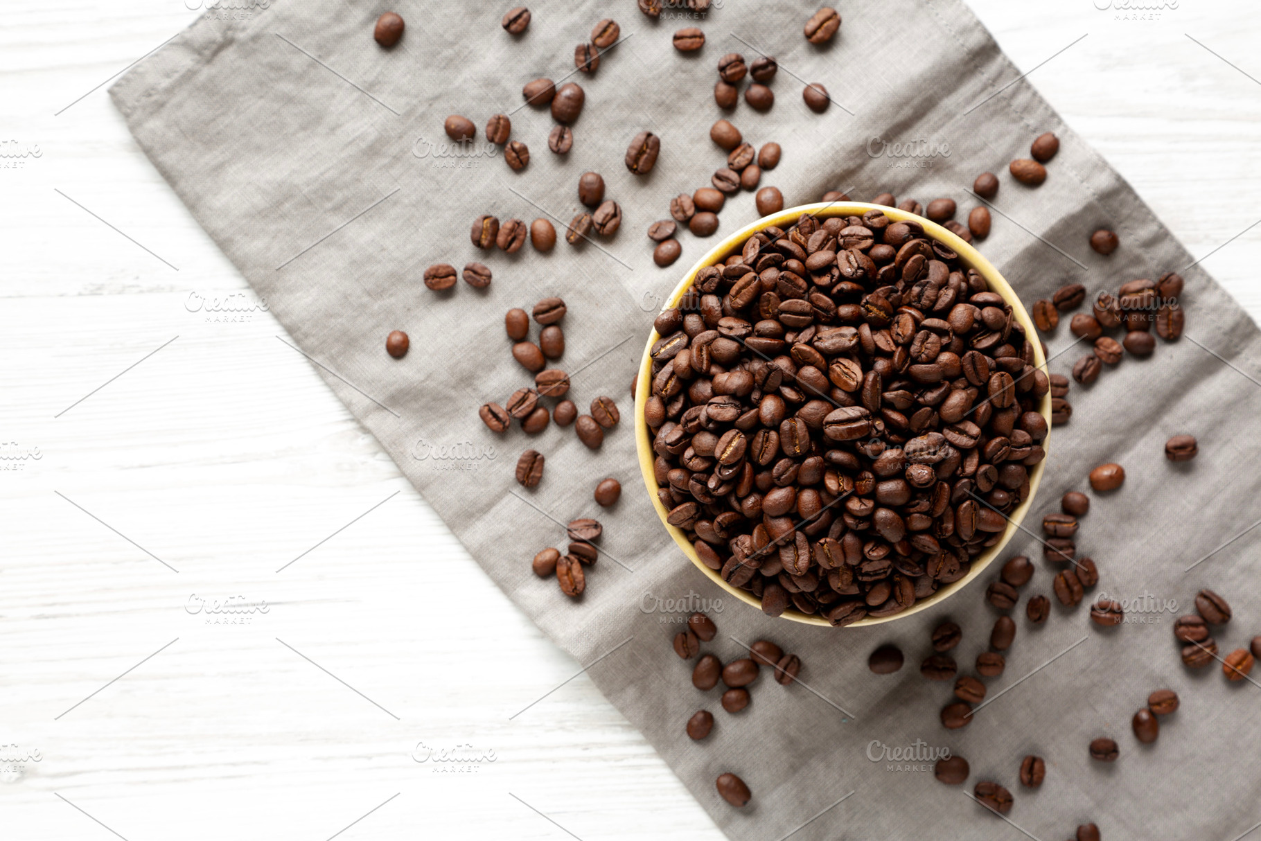 Organic Roasted Coffee Beans in a Bowl, top view., a Food & Drink Photo by LiudmylaChuhunova