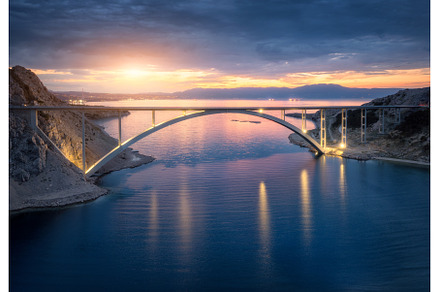 Bridge over the sea at sunset