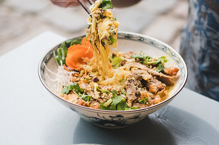 Man eating vietnamese noodle curry stock photo containing man and person, a Food & Drink Photo by Foxys