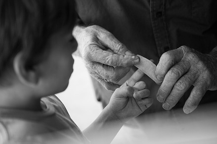 Old Hands Helping Young Hands in B/W