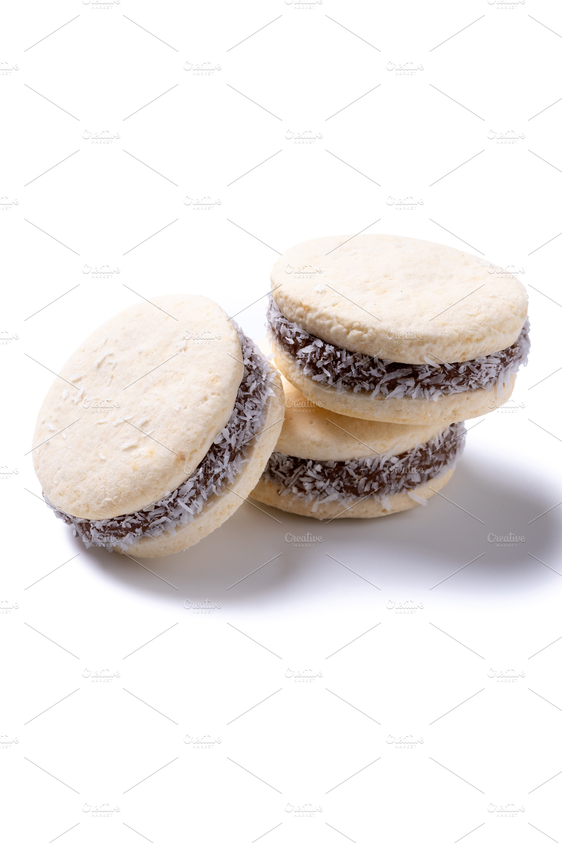 Traditional alfajores filled with dulce de leche and coconut, a Food & Drink Photo by etorres69
