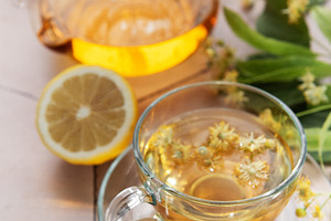 Linden herbal tea in glass cup and teapot, a Food & Drink Photo by Olena Rudo