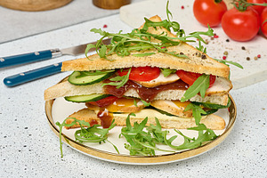 Sandwich with grilled chicken, fresh cucumber, tomato, arugula a, a Food & Drink Photo by ndanko