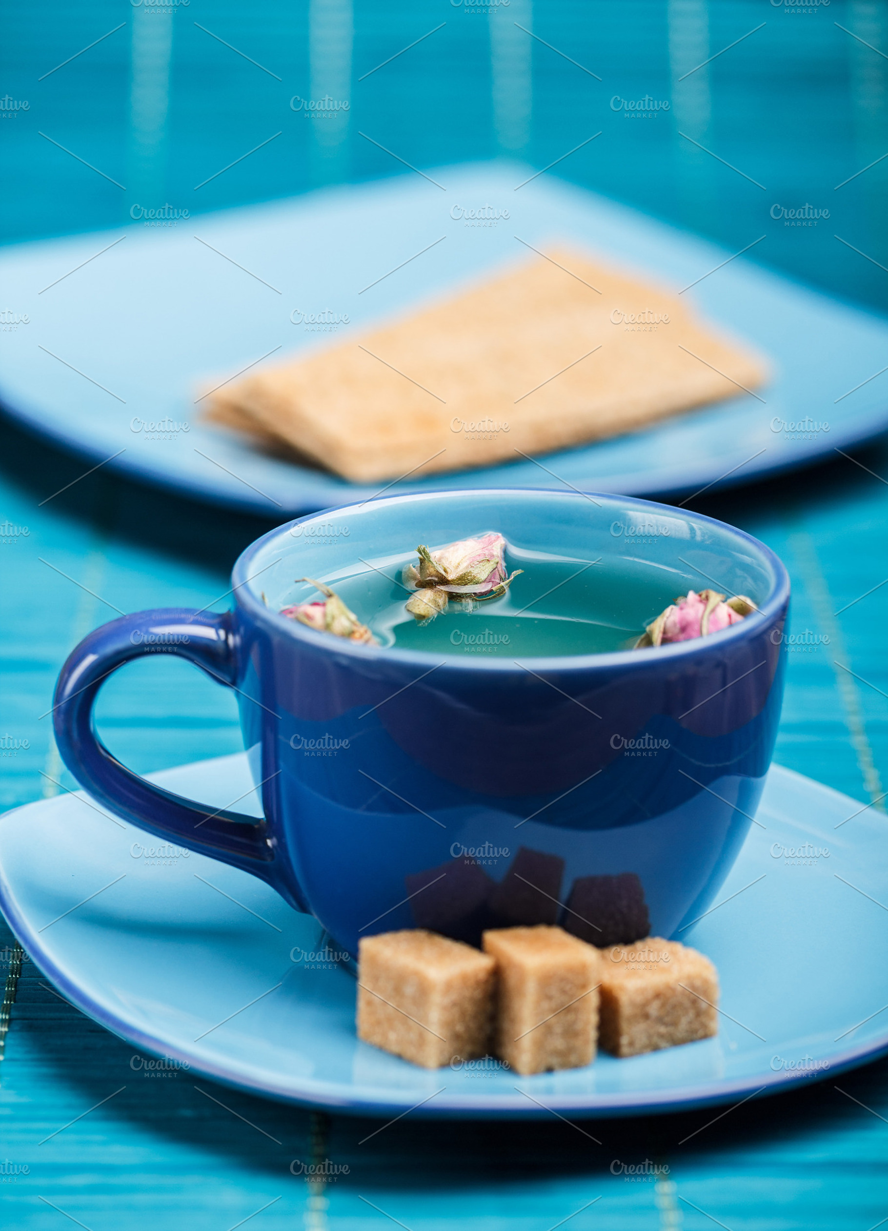 Blue tea cup containing cup, blue, and tea