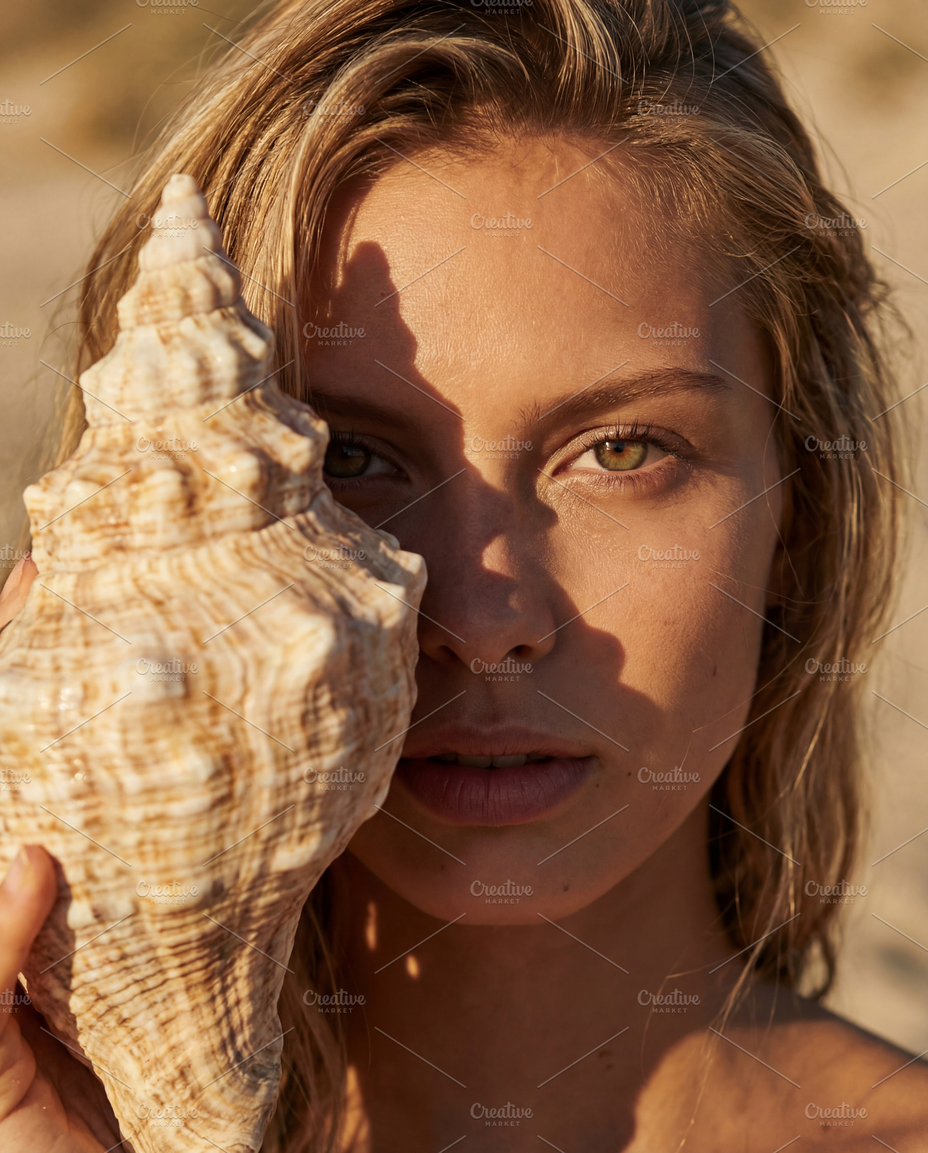 Portrait of Woman Holding a Shell, a Person Photo by Virgo Studio