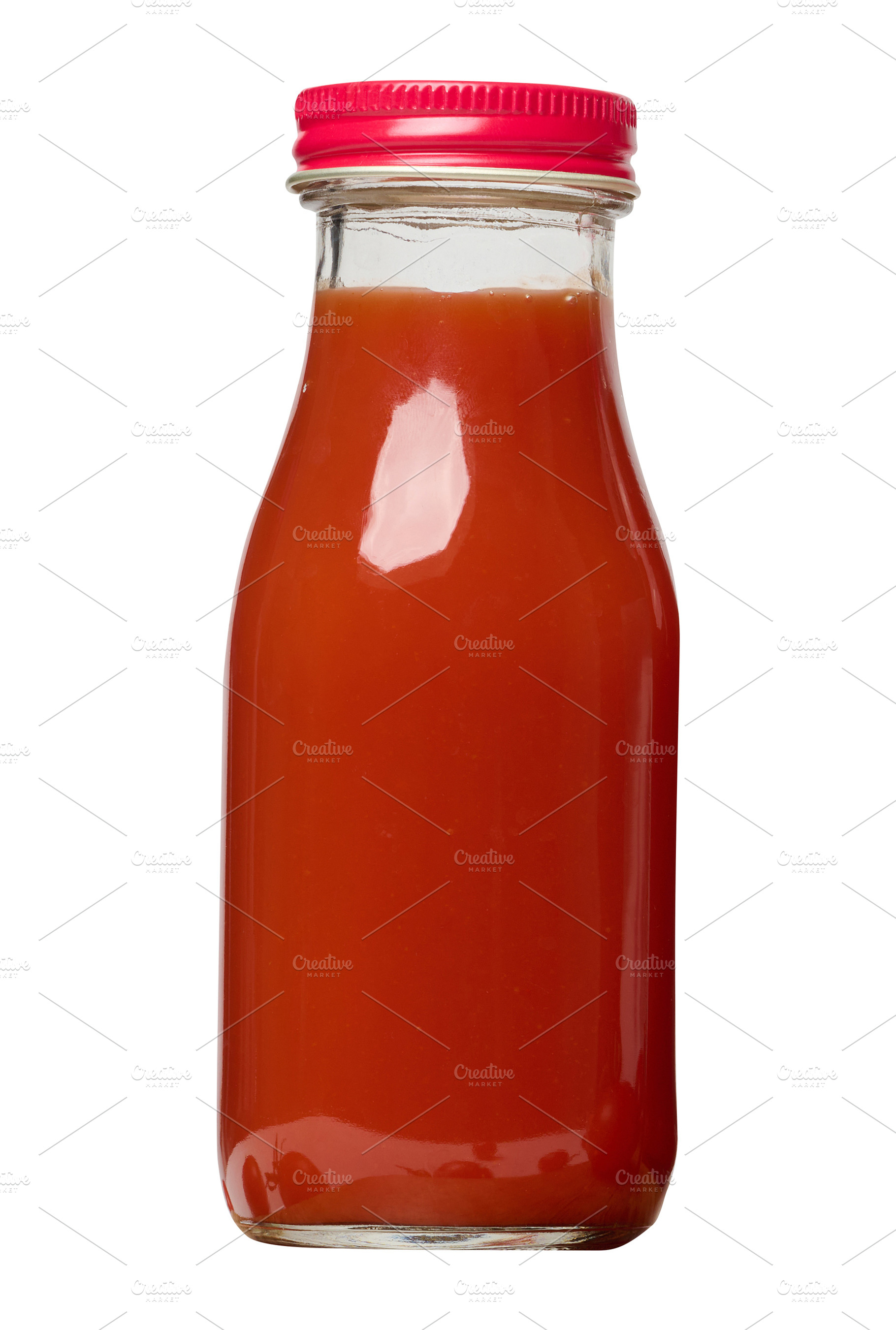Glass bottles with tomato juice with red caps., a Food & Drink Photo by ndanko
