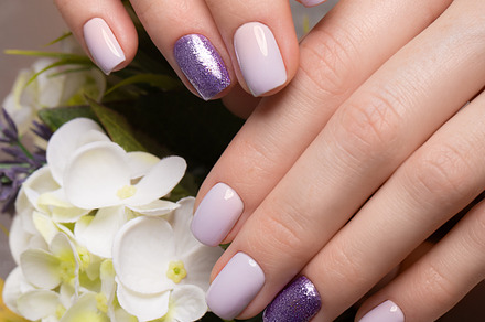 Purple neat manicure on female hands on flowers background nail design, a Beauty & Fashion Photo by KOBRIN|PHOTO