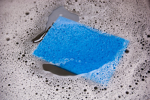 Blue Sponge In Dishwater, an Abstract Photo by THP Creative
