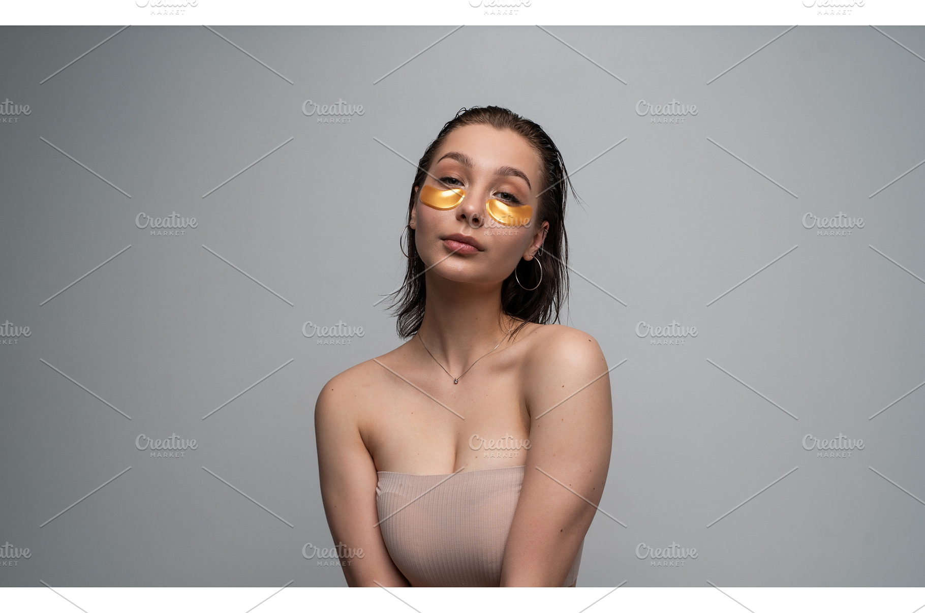 Young woman applying luxurious gold, a Health & Medical Photo by volodymyrshtun13795