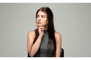 Young woman thinking deeply, a Person Photo by volodymyrshtun13795