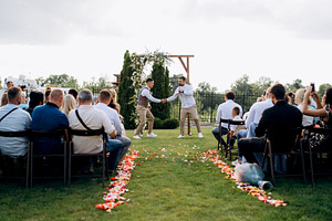 wedding ceremony of a young couple in love on a green meadow, a Photo by Weddings, People, Travel