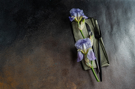 Table setting with pale blue iris flowers