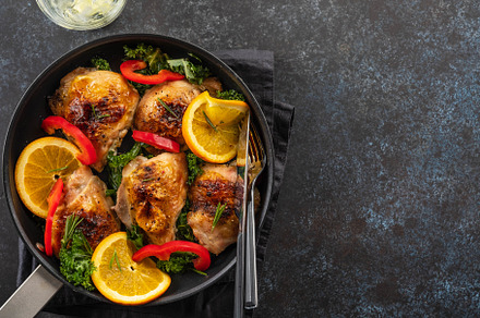 Pieces of chicken baked with oranges containing chicken, cooking, and cuisine