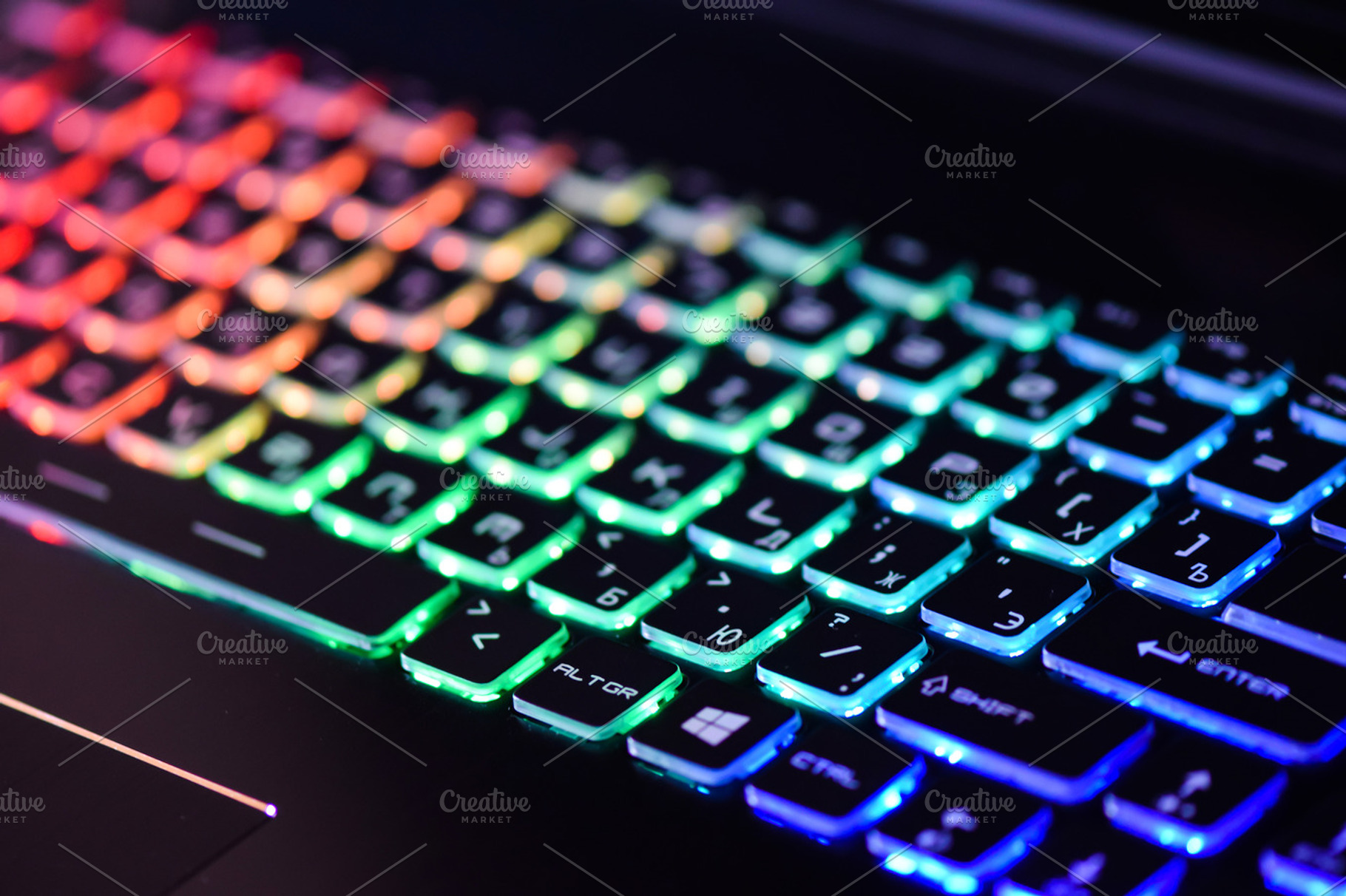 Laptop keyboard with backlight containing red, abstract, and information, a Technology Photo by Sisika