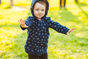 Little baby girl plays in the park stock photo containing people and portrait