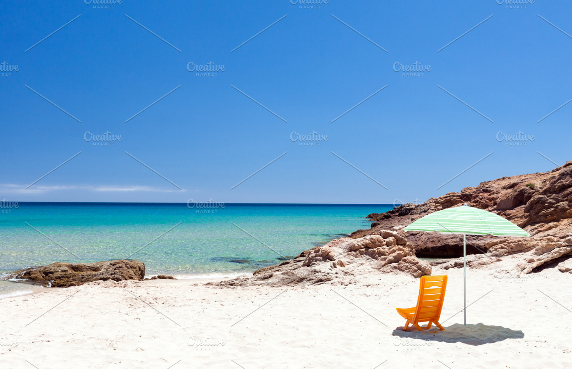 Chair and umbrella in the beach, a Nature Photo by BOOCYS
