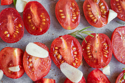 Fresh tomato slices with herbs, a Food & Drink Photo by Olena Rudo