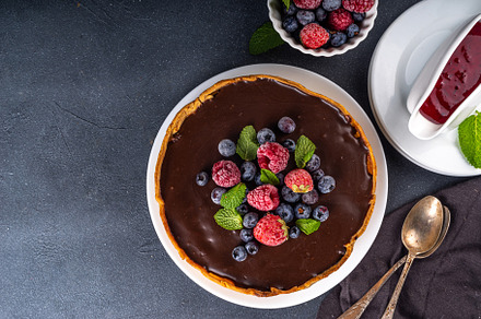 Homemade cheesecake with chocolate and berry, a Food & Drink Photo by Rimma