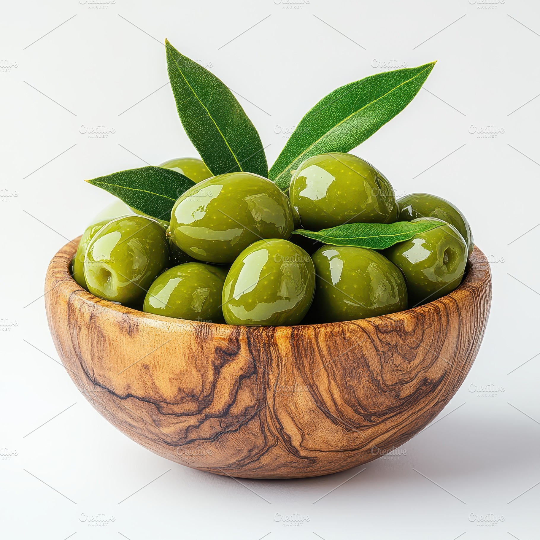 Green olives in wooden bowl with lea, a Food & Drink Photo by Pixeness Studio