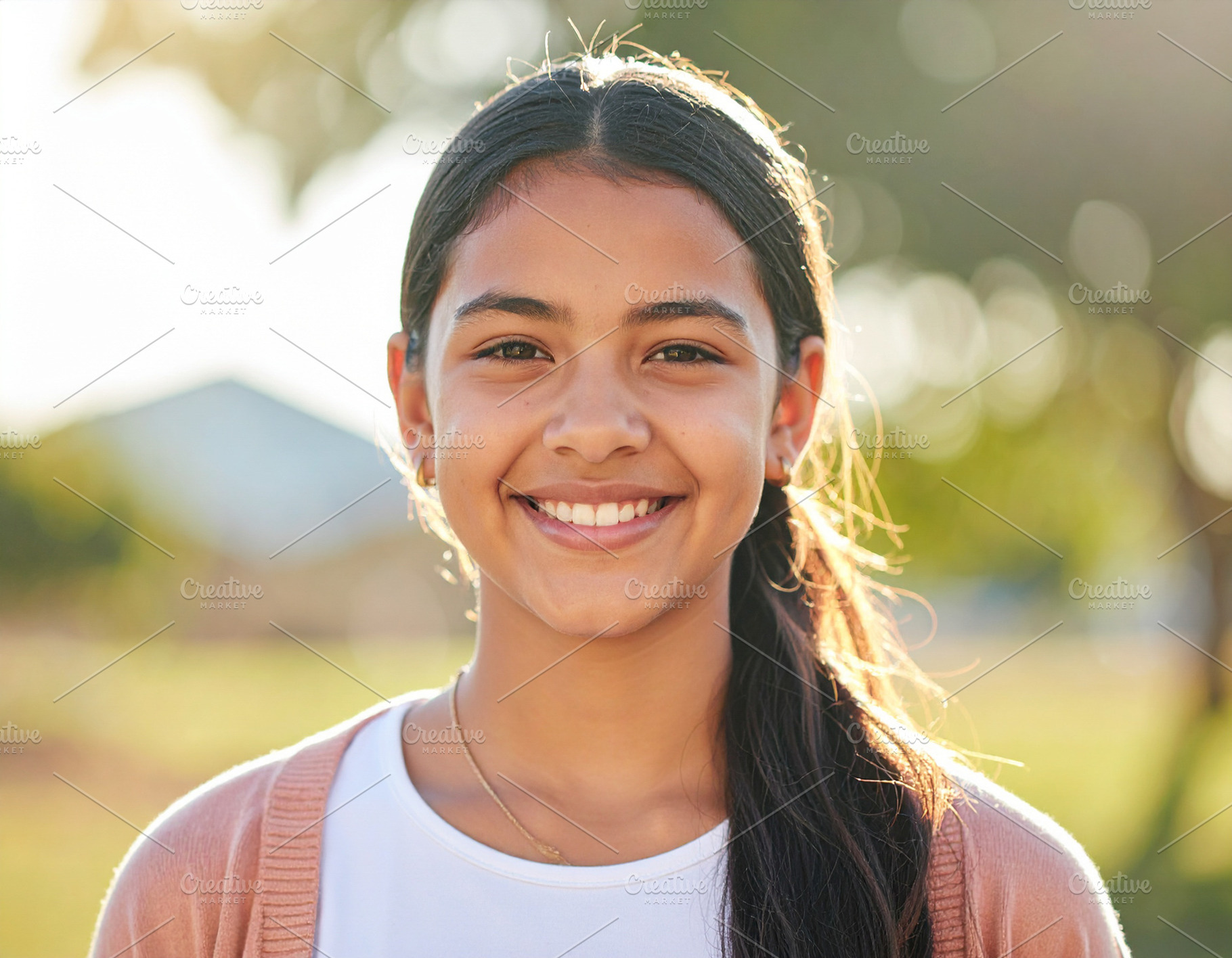 Teenage girl standing outdoors, looking directly at the camera, a Person Photo by DanFLCreativo