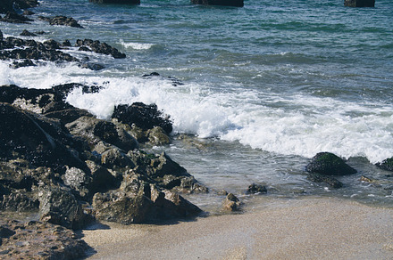 Rocks on the beach stock photo containing sea and ocean, a Nature Photo by tetxu