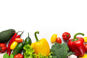 Fresh organic vegetables forming a colorful healthy food border, a Food & Drink Photo by Olena Rudo