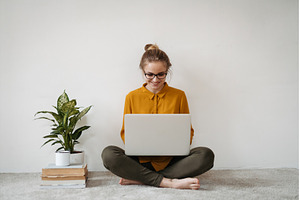 Young female student studying, a Person Photo by HalfPoint