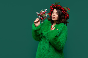 Elegant woman in green coat, a Holiday Photo by Elena Vagengeim